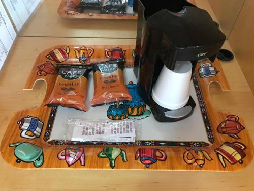 a coffee maker on a counter with a coffee machine at Sunset Motel in Gravelly Run