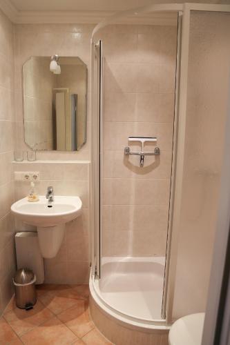 a bathroom with a shower and a sink at Strandperle in Westerland
