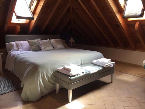 a bedroom with a large bed in a attic at Duplex Juderia in Córdoba