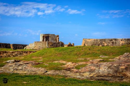 an old castle on top of a hill at Sirène Galle Fort in Galle