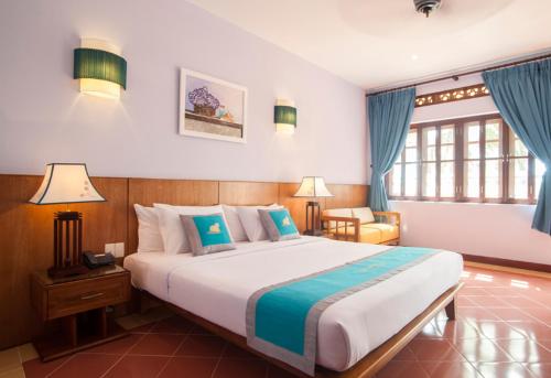 Postel nebo postele na pokoji v ubytování Phu Hai Beach Resort & Spa Phan Thiet