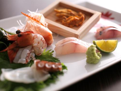 a plate of food with shrimp and other foods at Amahara in Sumoto