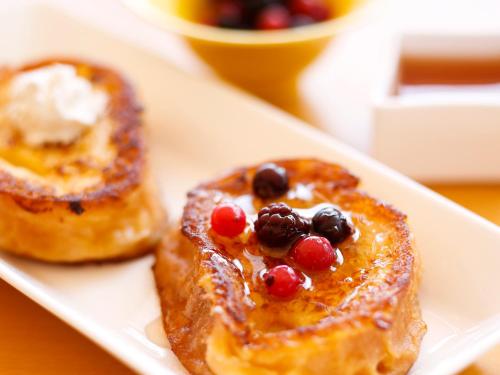 two pieces of toast with fruit on a white plate at Amahara in Sumoto