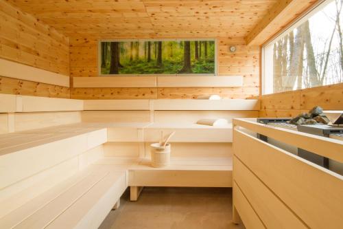 a sauna with wooden walls and a window at Schlosspark Mauerbach - Adults only in Mauerbach