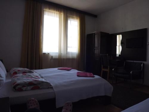 Postel nebo postele na pokoji v ubytování Guest house Elit