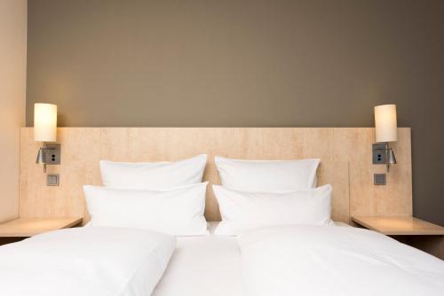 Ein Bett oder Betten in einem Zimmer der Unterkunft Mercure Hotel Bielefeld Johannisberg