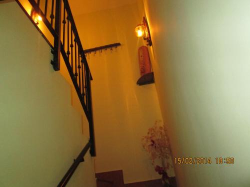 a hallway with stairs and lights in a house at serranía del tajo in Peñalén
