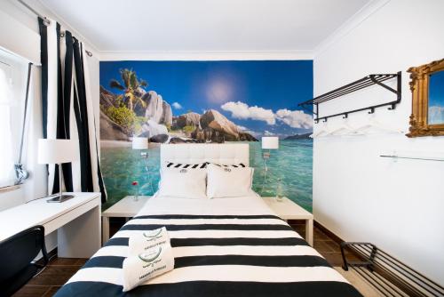 En eller flere senge i et værelse på PH in Setúbal