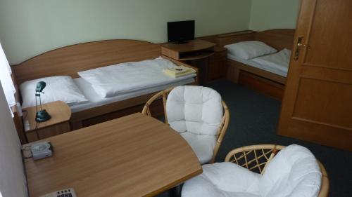 Postel nebo postele na pokoji v ubytování Hotel THT