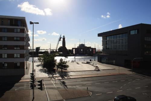 a view of a street in a city with buildings at Ferienwohnungen an der Weser in Bremerhaven