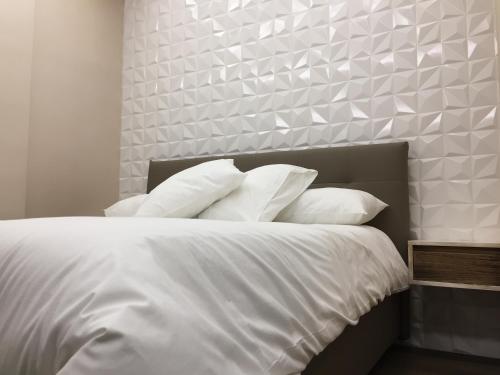 Postel nebo postele na pokoji v ubytování B&B Il Duomo