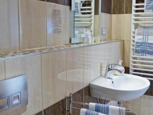 a bathroom with a sink and a mirror at Hotel Wald & Meer in Ostseebad Koserow