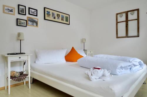 En eller flere senge i et værelse på Apartment MEZPRA
