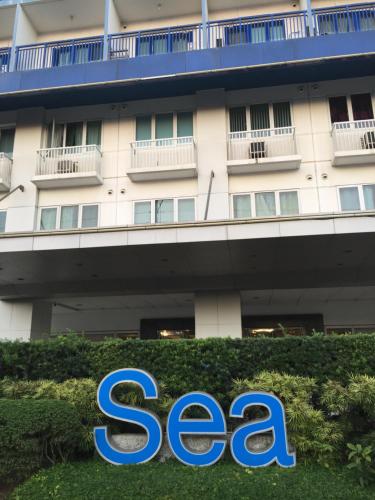a sign in front of a seagate hotel at Sea Residences MoA Manila in Manila