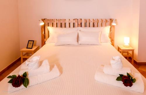 a bedroom with a bed with towels on it at Bonjour Bonheur in Avellino
