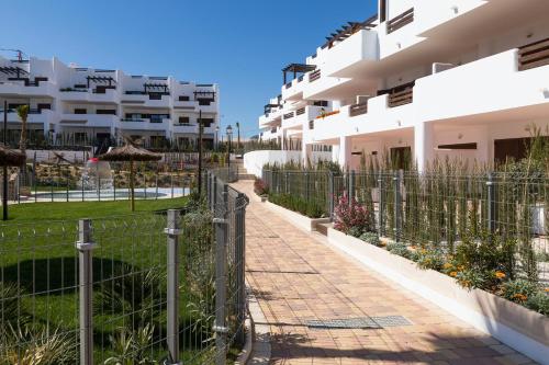 a walkway in front of a building at Mar de Pulpí Las Azucenas by Mar Holidays in San Juan de los Terreros