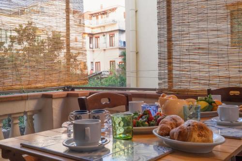 a table with a plate of food on top of it at Casa Miranda in Vico Equense