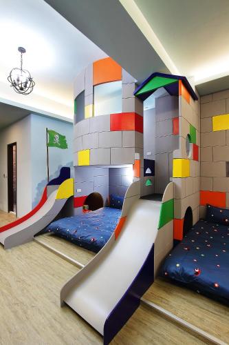 a childrens room with a castle bunk bed at Jack Castle in Tainan