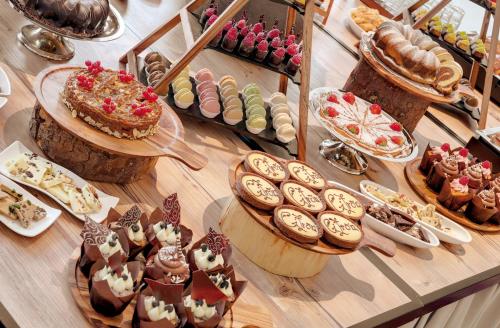 a display of desserts and pastries on a table at Morosani Schweizerhof in Davos