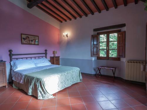 a bedroom with a bed and a window at Holiday home in Dicomano FI in Dicomano