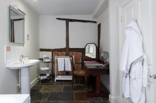 a bathroom with a sink and a mirror at The Old Vine in Winchester