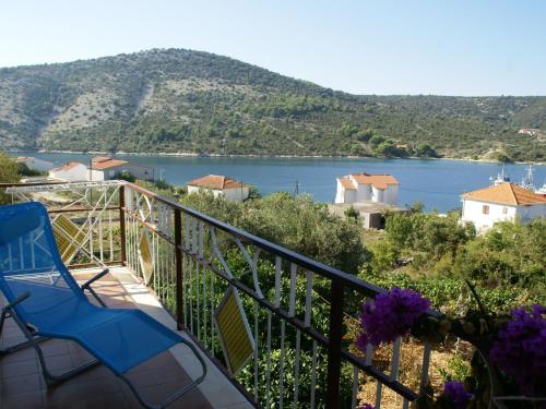 a balcony with a view of a body of water at Neat apartment in Vinisce with magnificent sea and beach within walking distance in Vinišće