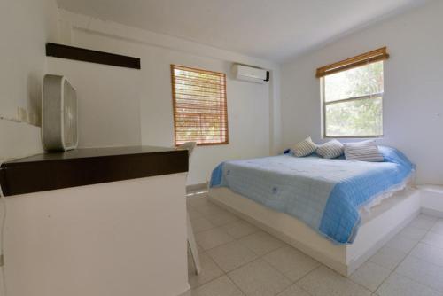 Säng eller sängar i ett rum på Casa Korora
