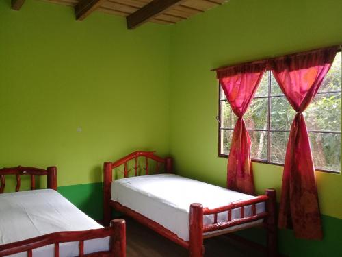 Ένα ή περισσότερα κρεβάτια σε δωμάτιο στο Vista Verde Lodge