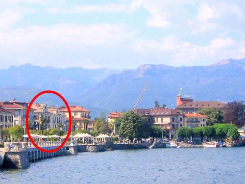 a red circle in the middle of a body of water at In the heart of Baveno within walking distance of the lake in Baveno