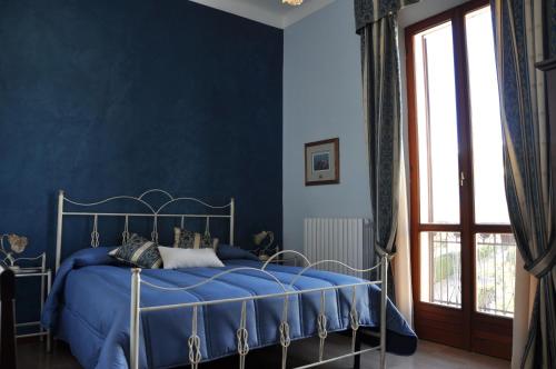 Кровать или кровати в номере Villa Del Poeta