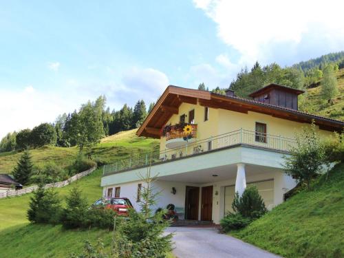 a house on the side of a hill at Apartment close to the ski area in Hüttschlag