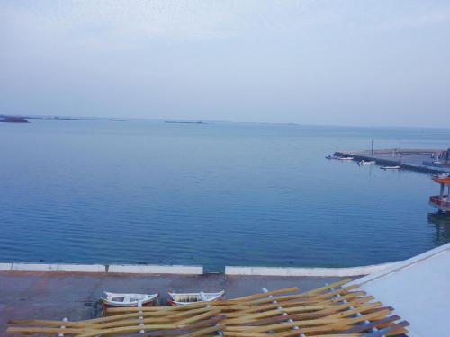 a group of boats sitting on top of the water at Ocean Sky B&B in Huxi