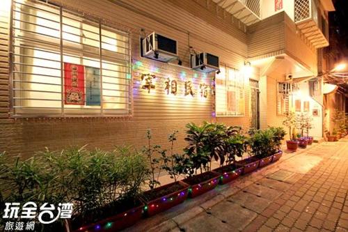 a building with christmas lights on the side of it at ZaiXiang in Tamsui
