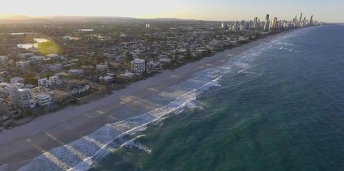 an aerial view of a beach with buildings and the ocean at Albatross North Apartments in Gold Coast
