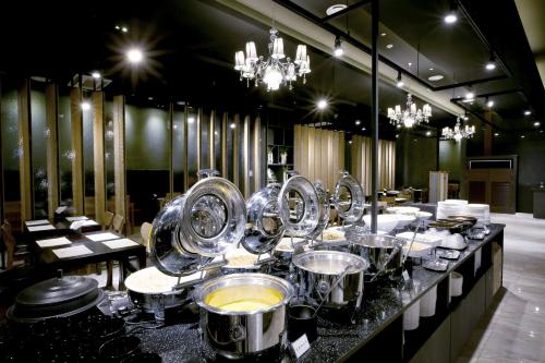 a buffet line with many dishes in a restaurant at Golden City Hotel Dongdaemun in Seoul