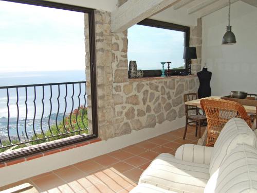 a living room with a view of the ocean at Classy Apartment in La Turbie with Fenced Garden in La Turbie