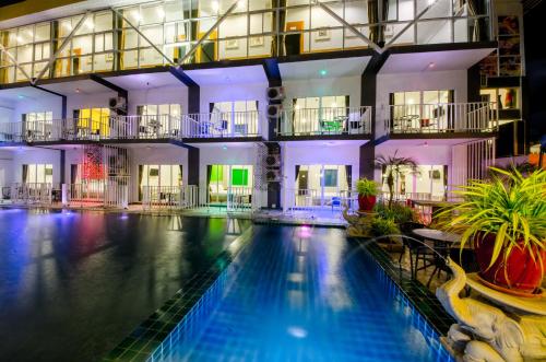 a large building with a large swimming pool at Anantra Pattaya Resort in Pattaya