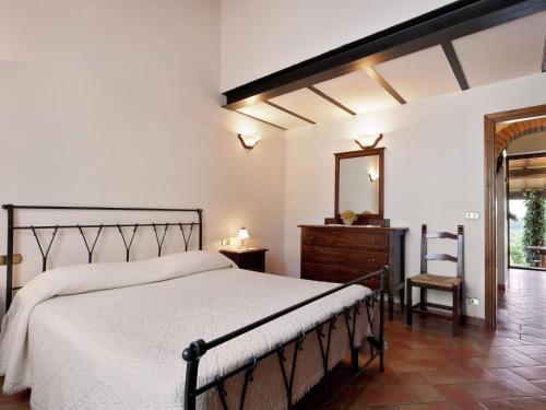 En eller flere senge i et værelse på Scenic Home in Foiano della Chiana with Terrace