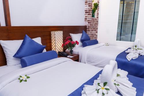 Ένα ή περισσότερα κρεβάτια σε δωμάτιο στο Tuana Hotels Brook Pool Access