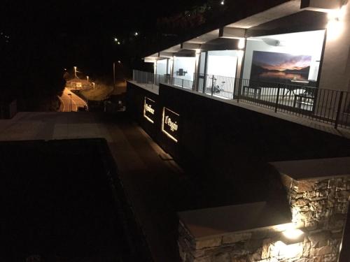 a night view of a building with lights on it at Residence Il Poggio in Dorio