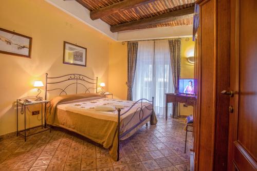 Posteľ alebo postele v izbe v ubytovaní B&B L'Alloggio Dei Vassalli
