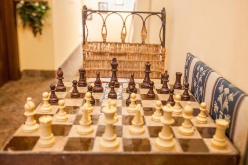 a chess board sitting on top of a table at B&B L'Alloggio Dei Vassalli in Naples