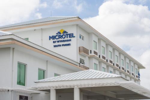 a rendering of the front of a hotel at Microtel by Wyndham South Forbes near Nuvali in Santa Rosa