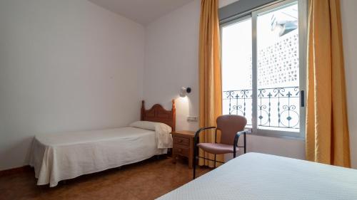 Кровать или кровати в номере Hotel Andalucia