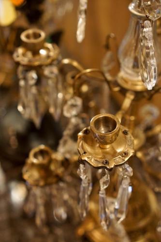a group of gold candlesticks on a table at Boutique Hotel De Brakelhoen in Brakel