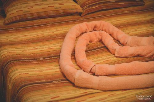an orange life preserver on a wooden floor at Guest House Vila Banjica in Pirot