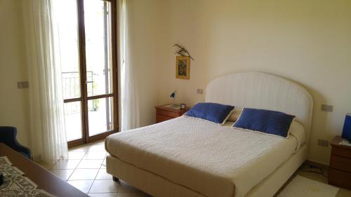 Un Angolo di Paradiso tesisinde bir odada yatak veya yataklar