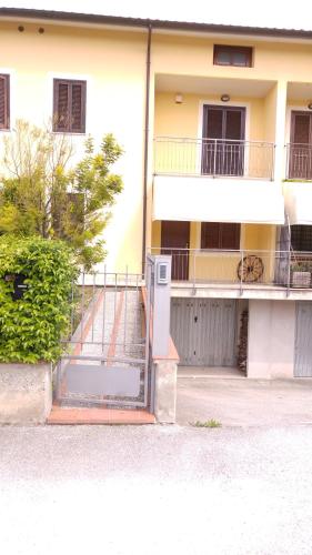 a house with a gate in front of a building at Un Angolo di Paradiso in Spoleto