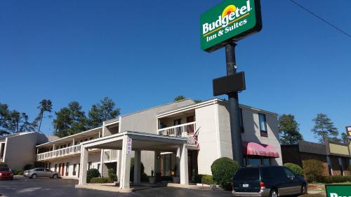 a building with a burger king sign in front of it at Budgetel Inn and Suites- FORT GORDON in Augusta
