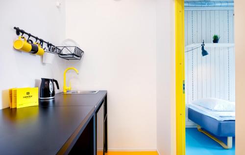 Kuchyň nebo kuchyňský kout v ubytování Hektor Design Hostel